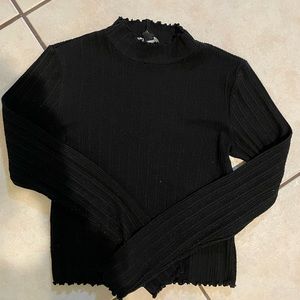 Black turtleneck ruffle neck and sleeves